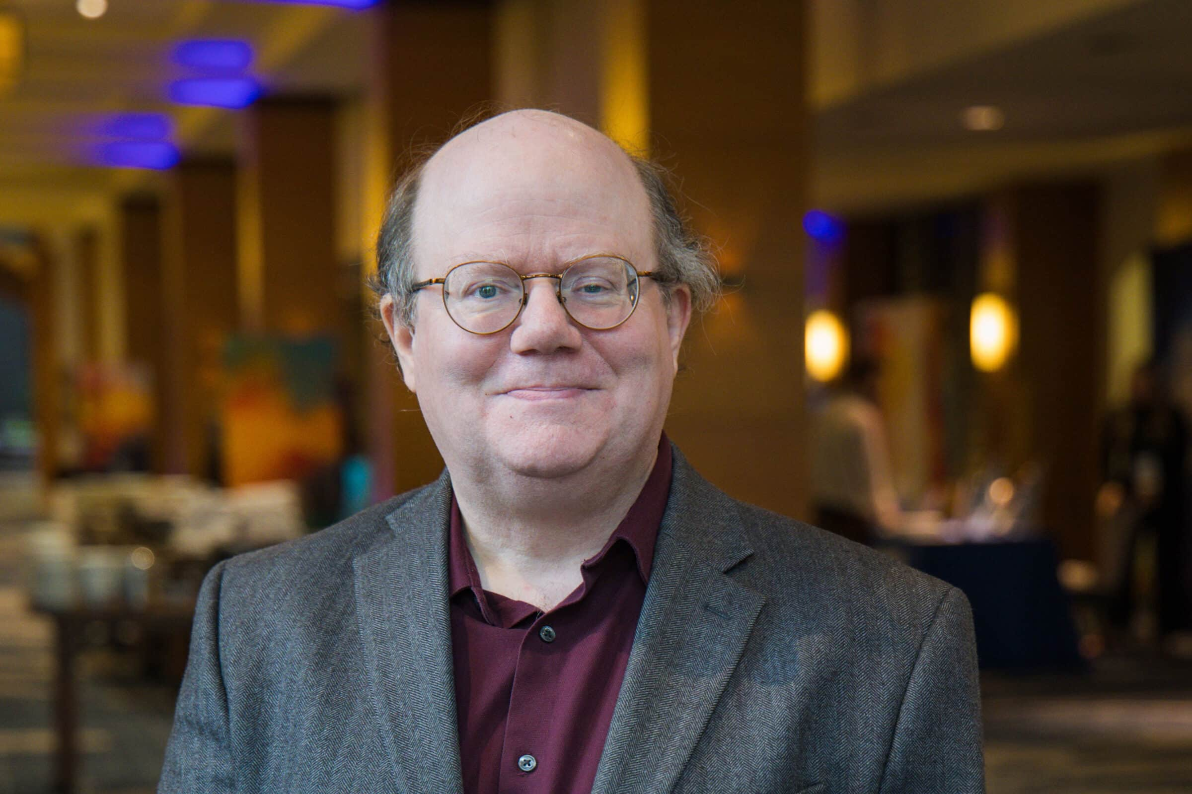 Wikipedia co-founder Larry Sanger speaking at the 2024 COSM Technology Summit.