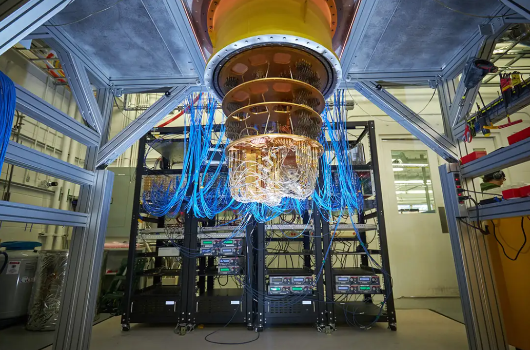 Google’s Sycamore quantum computer with blue wiring and golden cryostat structure